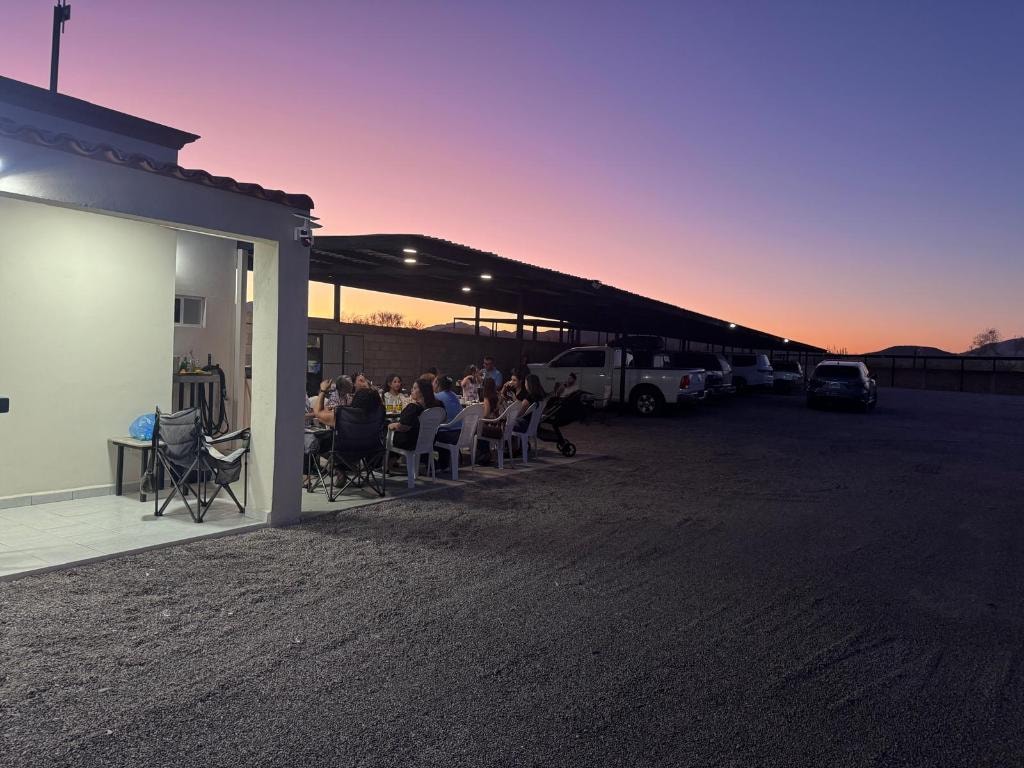 Outdoor gathering at dusk at the By The Airport Storage customer appreciation event